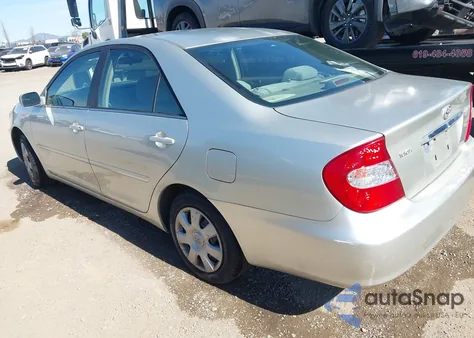 2002 Toyota Camry Le z USA, uszkodzony, nr VIN JTDBE32K320040988